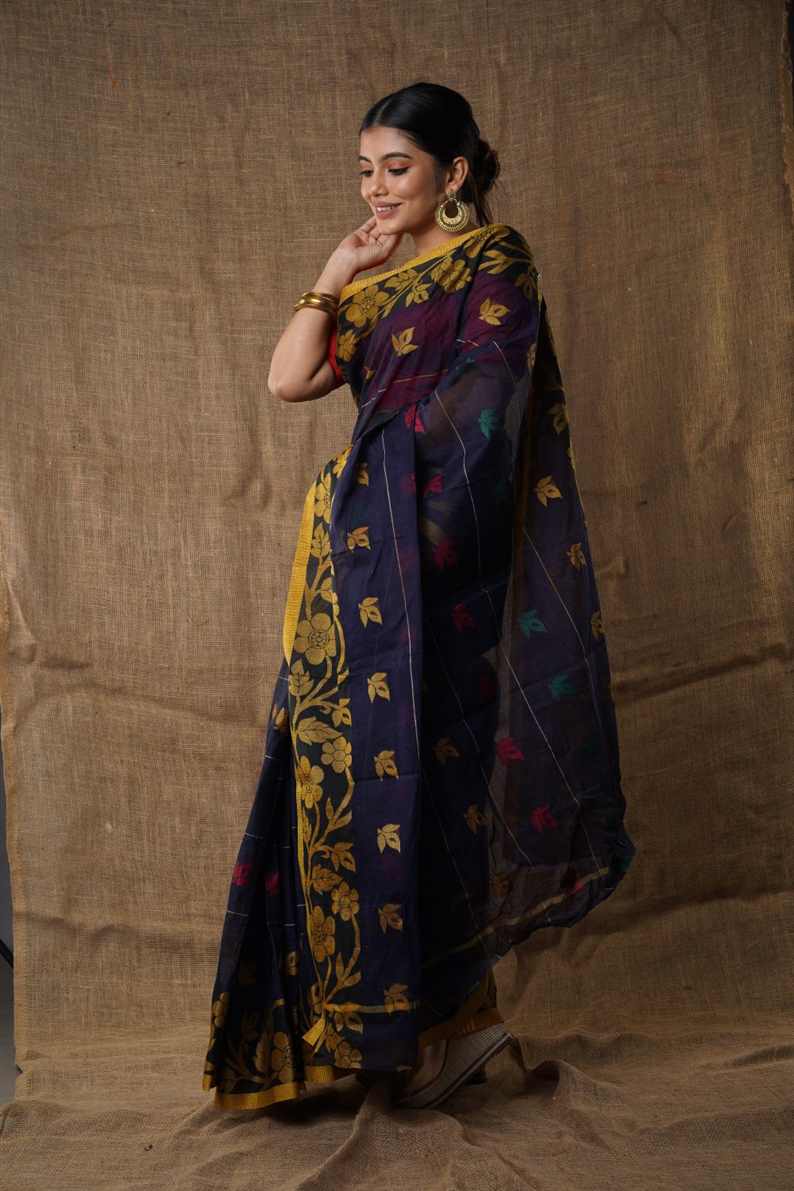 Traditional navy blue colour Pure Cotton Bengali Handloom Tant Saree Without Blouse Piece 𝐒𝐢𝐳𝐞: Length: 5.5 Meters Width: 1.2 Meters Showcasing the Rich Cultural Heritage of Bengal.DN NO-1014