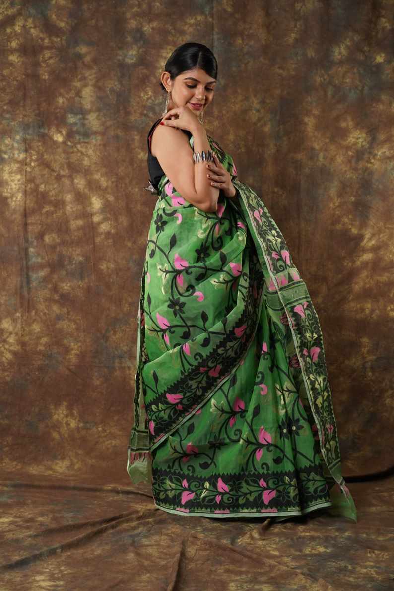 Traditional Bengal Cotton Silk Soft Jamdani Saree with green colour floral combination ,Handwoven in the Rich Heritage of Bengal Minakari Dhakai | Item Length: 5.5 Metres Width: 1.2 Meters | Without Blouse Piece.