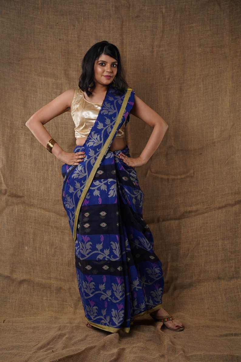 Traditional floral navy blue colour Pure Cotton Bengali Handloom Tant Saree Without Blouse Piece 𝐒𝐢𝐳𝐞: Length: 5.5 Meters Width: 1.2 Meters Showcasing the Rich Cultural Heritage of Bengal