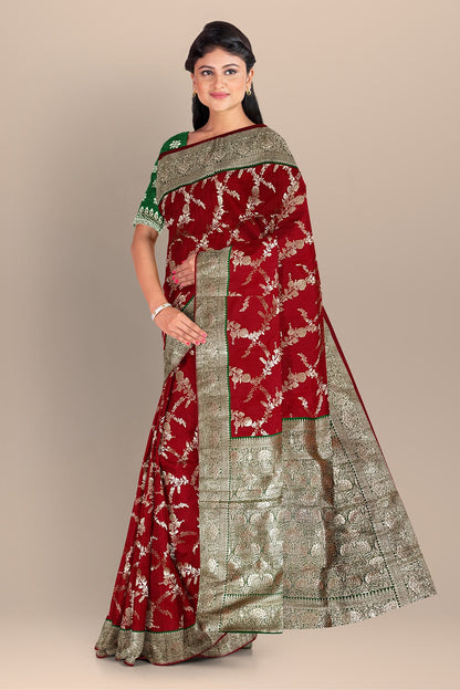 Red and Green Silk Saree with Contrasting Kalka Designs and Buta Blouse
